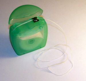 dental floss in green packaging