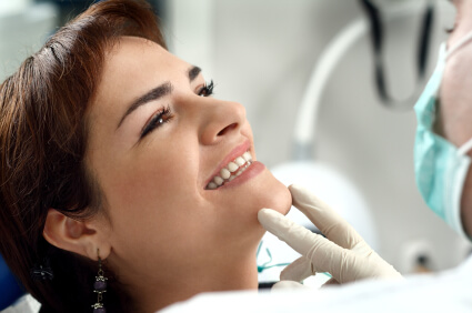 Alexandria VA dentist consulting a female patient sitting in dental chair